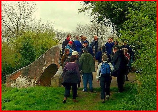 Some of the walkers congregating on the bridge at the link between the Grand Union and Stratford on Avon canals